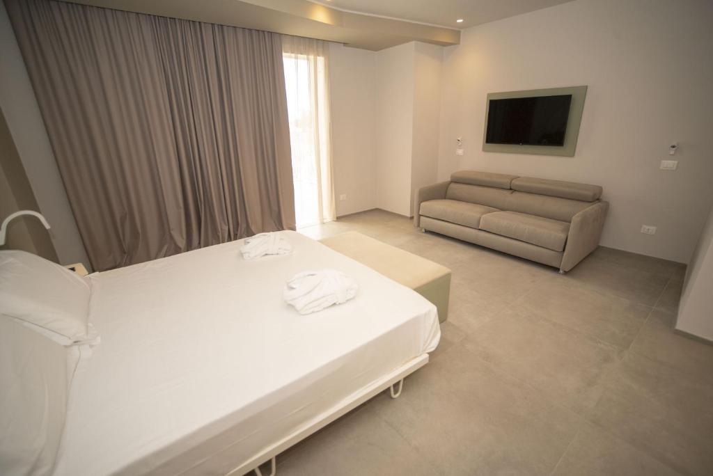 Posteľ alebo postele v izbe v ubytovaní Hotel Malavoglia