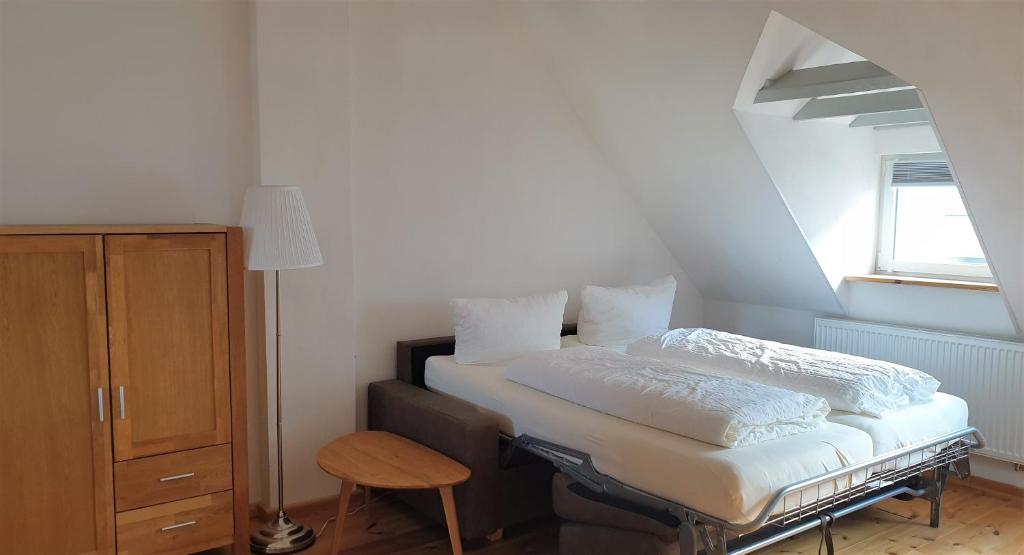 Postel nebo postele na pokoji v ubytování Südhotel