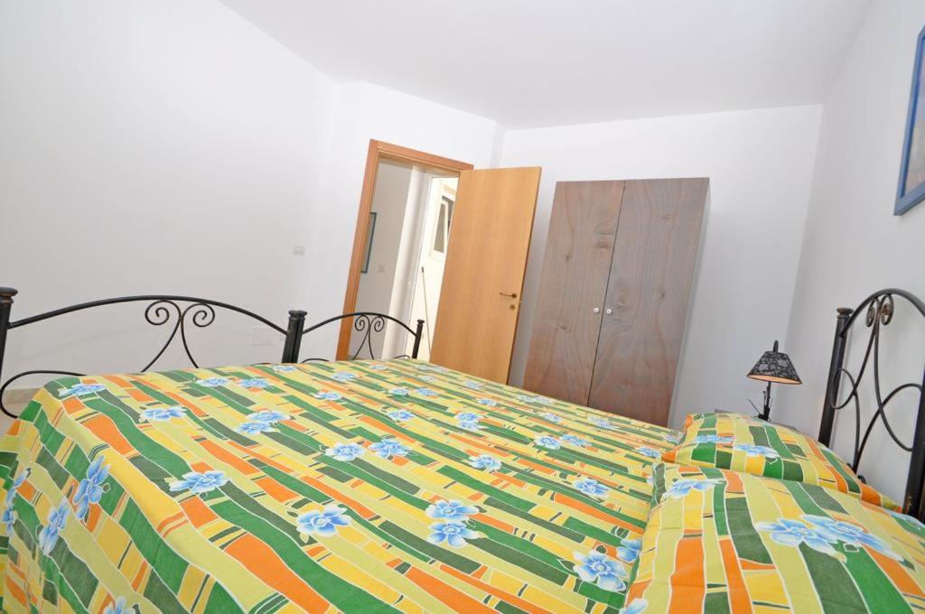 Postel nebo postele na pokoji v ubytování Residence Punta Pizzo