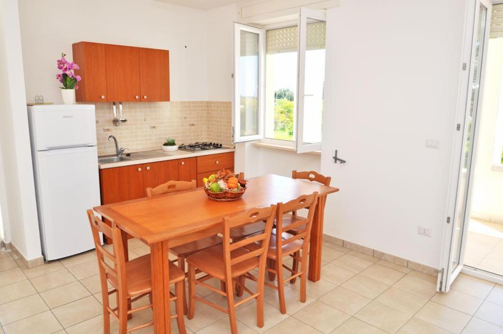 Kuchyň nebo kuchyňský kout v ubytování Residence Punta Pizzo