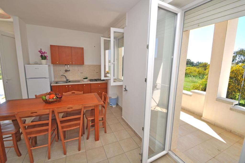 Kuchyň nebo kuchyňský kout v ubytování Residence Punta Pizzo