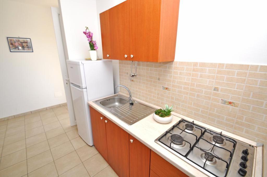 Kuchyň nebo kuchyňský kout v ubytování Residence Punta Pizzo
