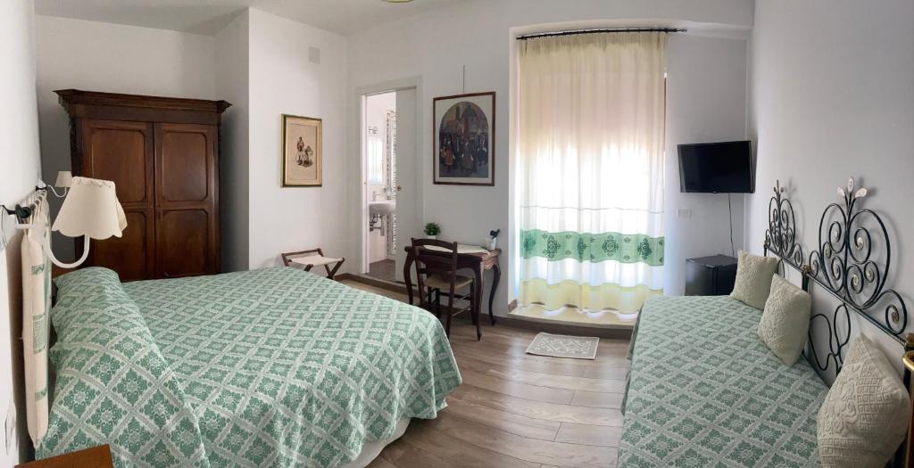 Postel nebo postele na pokoji v ubytování Su Corittu Guesthouse
