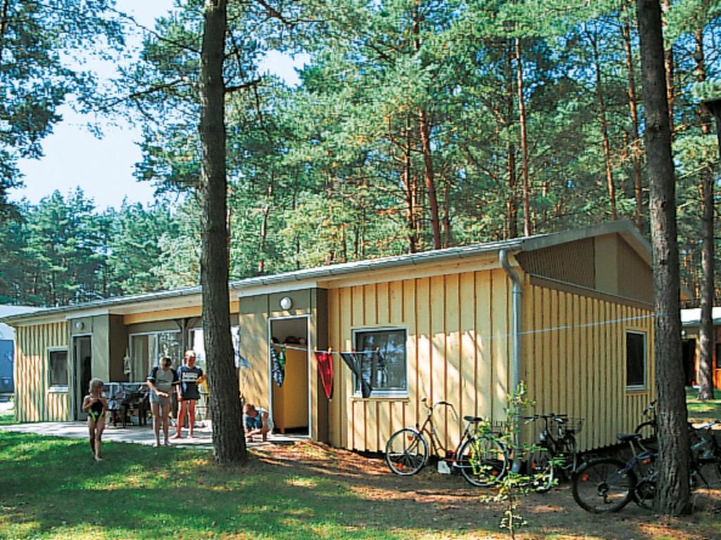 a building with bikes parked in front of it at Holiday Home Silz am Fleesensee-3 by Interhome in Silz