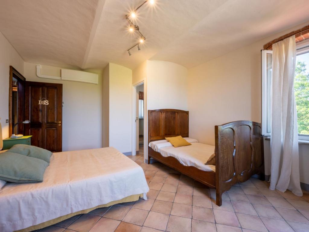 A bed or beds in a room at Holiday Home Marmorito by Interhome