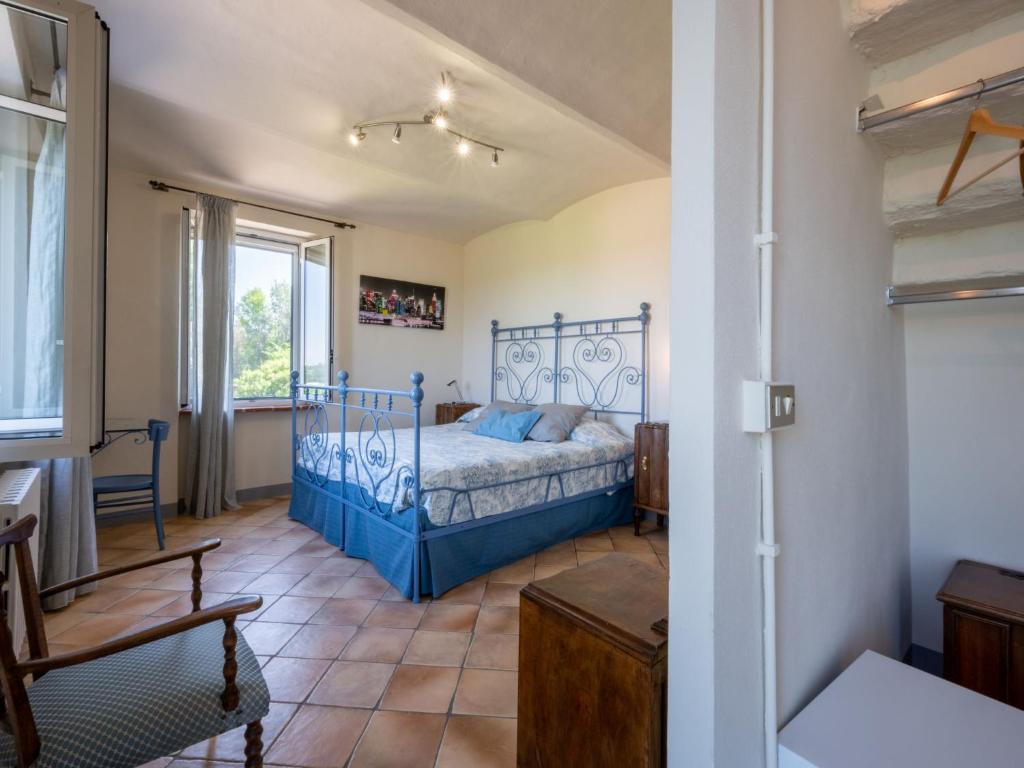 A bed or beds in a room at Holiday Home Marmorito by Interhome