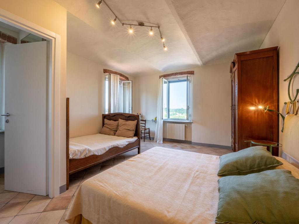 A bed or beds in a room at Holiday Home Marmorito by Interhome