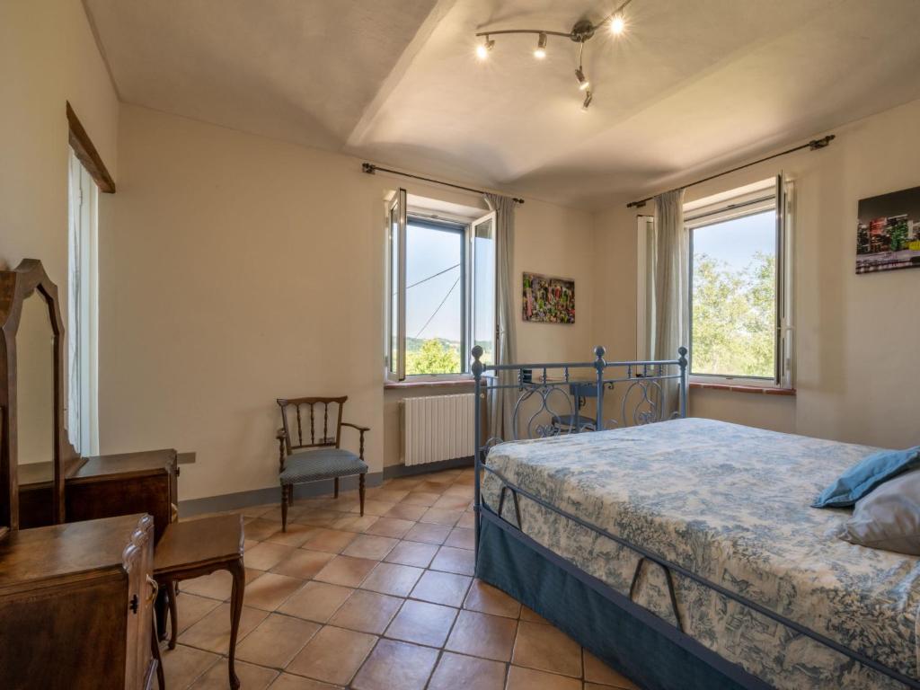A bed or beds in a room at Holiday Home Marmorito by Interhome