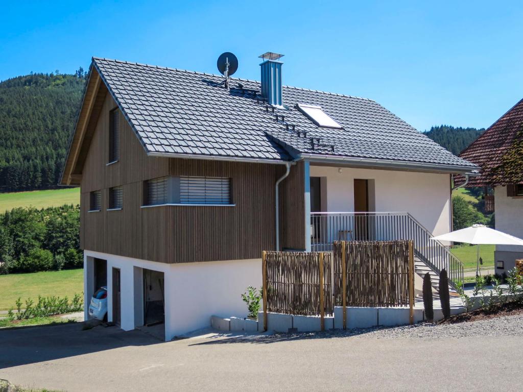 a house with a brown and white at Apartment Kinast - HFT201 by Interhome in Hofstetten