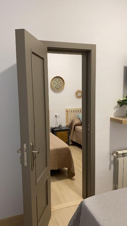 Postel nebo postele na pokoji v ubytování Jerez Hostel