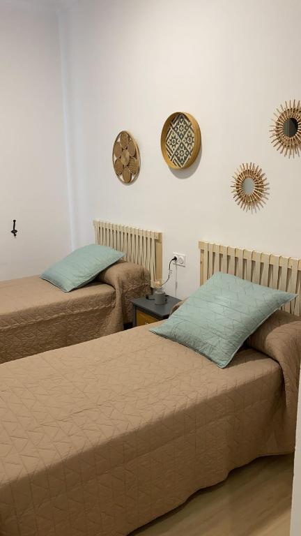 Postel nebo postele na pokoji v ubytování Jerez Hostel
