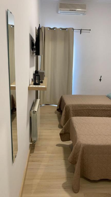 TV a/nebo společenská místnost v ubytování Jerez Hostel