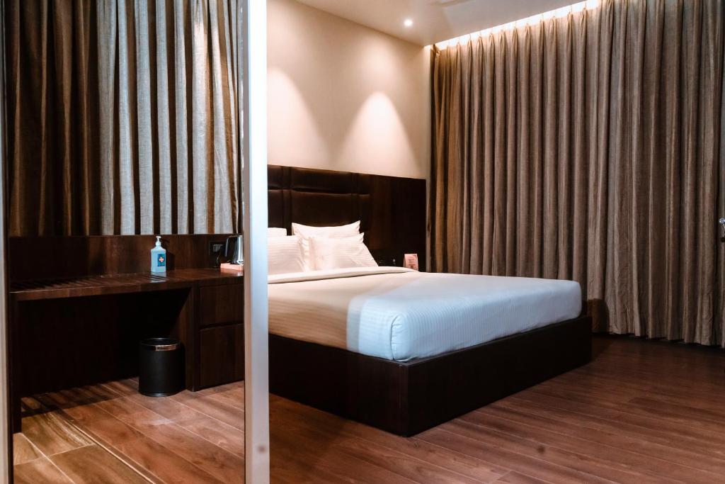 Postel nebo postele na pokoji v ubytování ECONEST HOTEL
