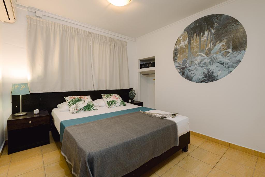 Posteľ alebo postele v izbe v ubytovaní Tortuga Dafni Bay Villas Diver's Paradise by "elite"