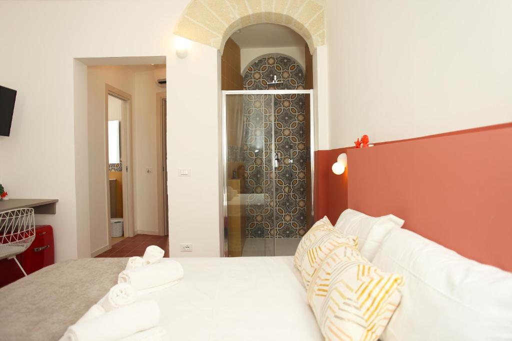 Postel nebo postele na pokoji v ubytování Casa Maja rooms & suites