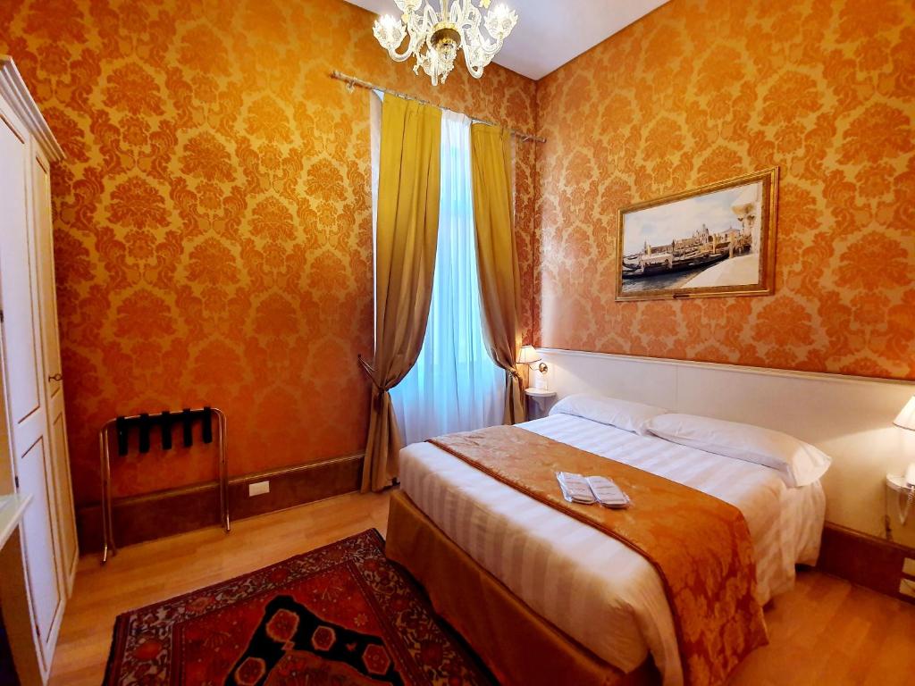 Postel nebo postele na pokoji v ubytování Hotel Corte dei Greci