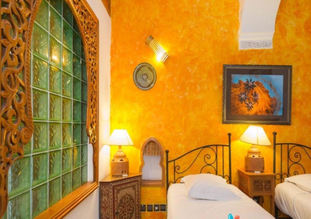 Postel nebo postele na pokoji v ubytování Riad Maison Arabo-Andalouse