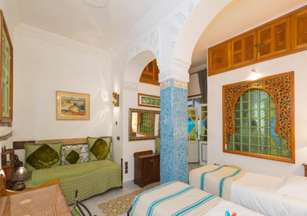 Postel nebo postele na pokoji v ubytování Riad Maison Arabo-Andalouse