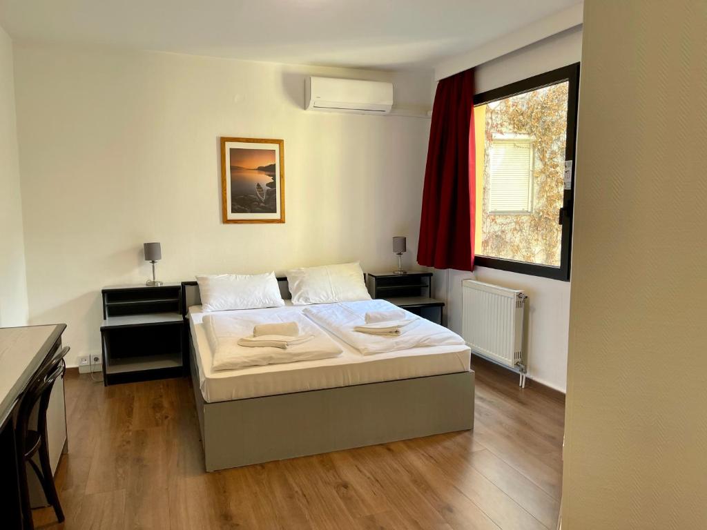 Posteľ alebo postele v izbe v ubytovaní Thomas Hotel Budapest