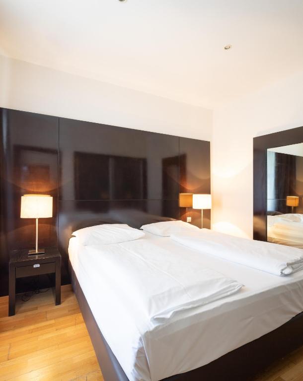 Letto o letti in una camera di The Levante Rathaus Apartments