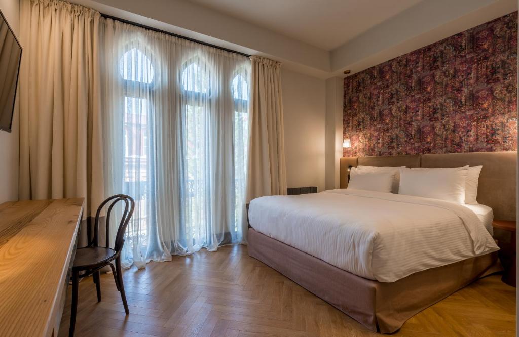 Postel nebo postele na pokoji v ubytování Abanotubani Boutique hotel