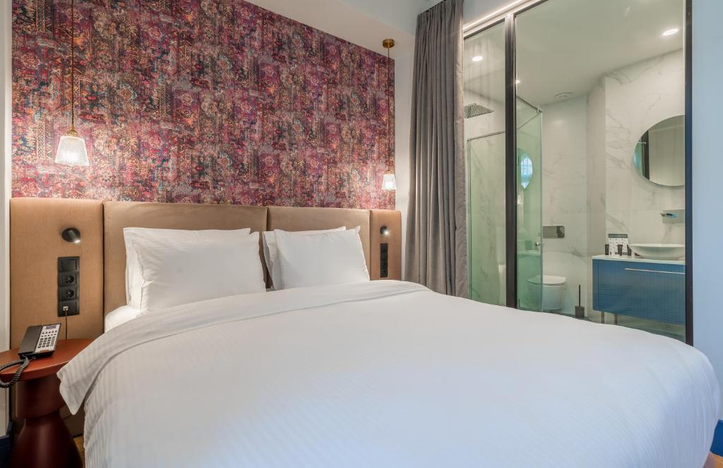 Postel nebo postele na pokoji v ubytování Abanotubani Boutique hotel