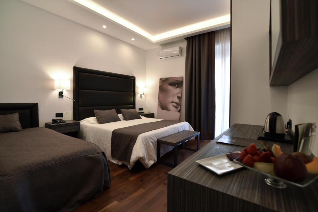 Postel nebo postele na pokoji v ubytování Hotel Palma