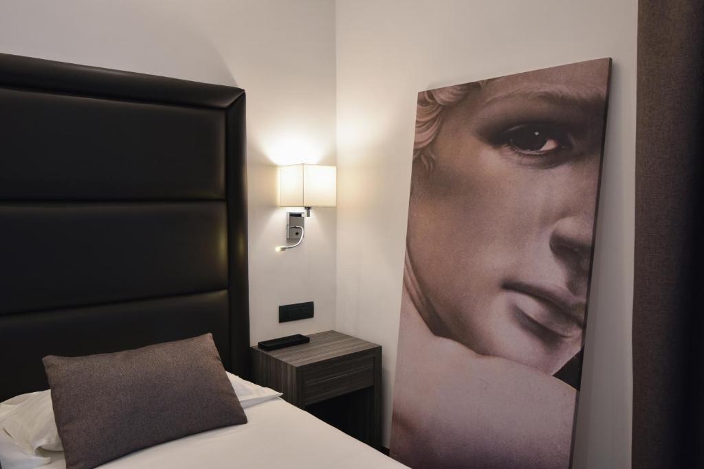Postel nebo postele na pokoji v ubytování Hotel Palma