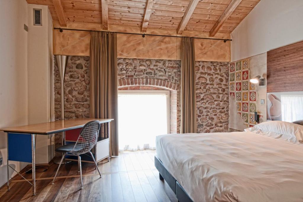 Postel nebo postele na pokoji v ubytování Hotel Veronesi La Torre