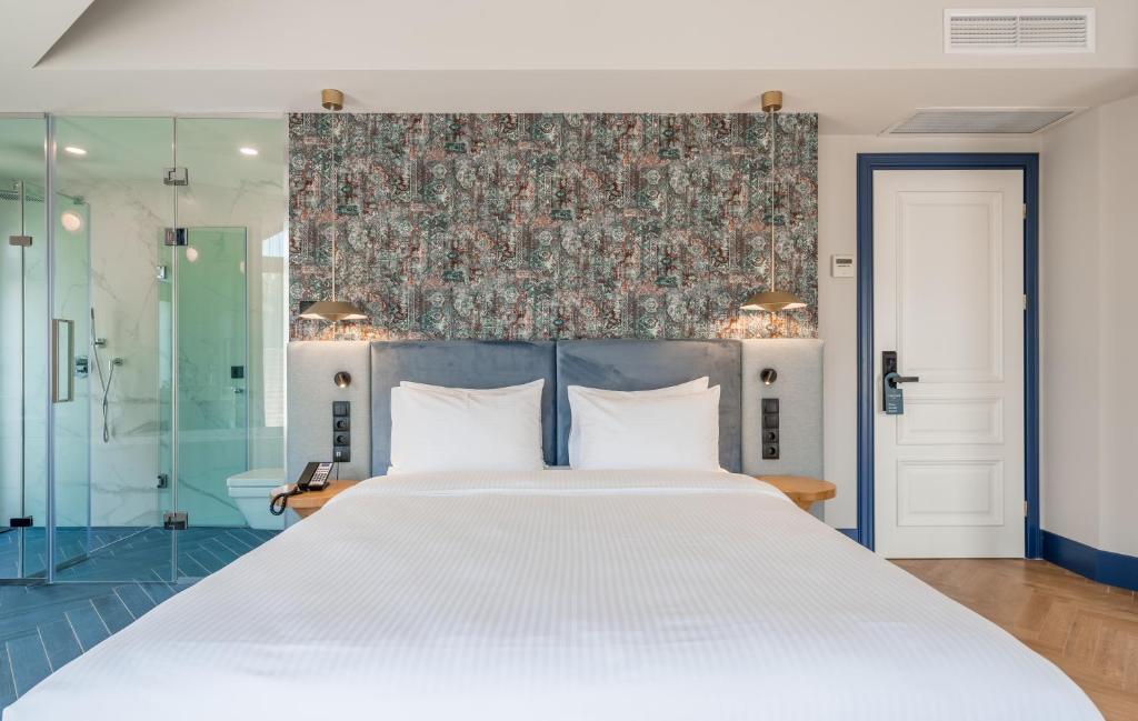 Postel nebo postele na pokoji v ubytování Abanotubani Boutique hotel