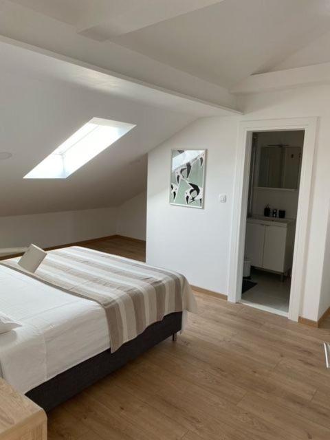 Postel nebo postele na pokoji v ubytování Apartments Vala
