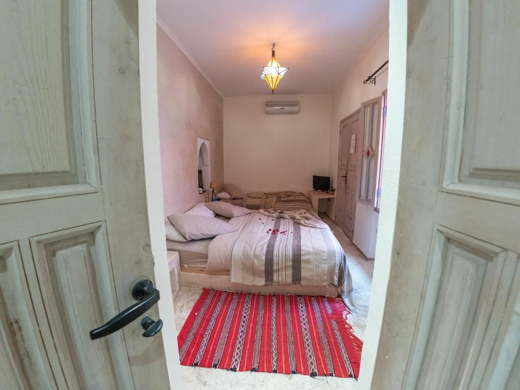 Postel nebo postele na pokoji v ubytování Riad Tahani