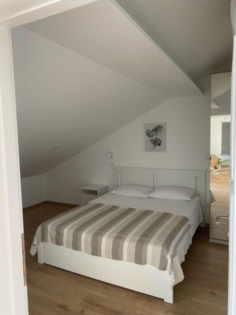 Postel nebo postele na pokoji v ubytování Apartments Vala