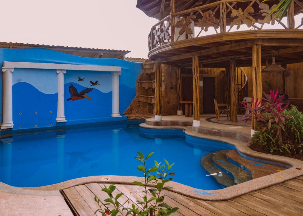 Bazén v ubytování Hostal Poseidon nebo v jeho okolí