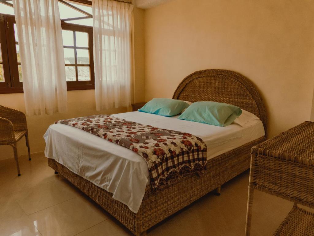 Postel nebo postele na pokoji v ubytování Hostal Poseidon