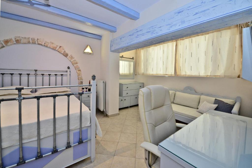 Postel nebo postele na pokoji v ubytování Santa Katerina Apartments & Studios