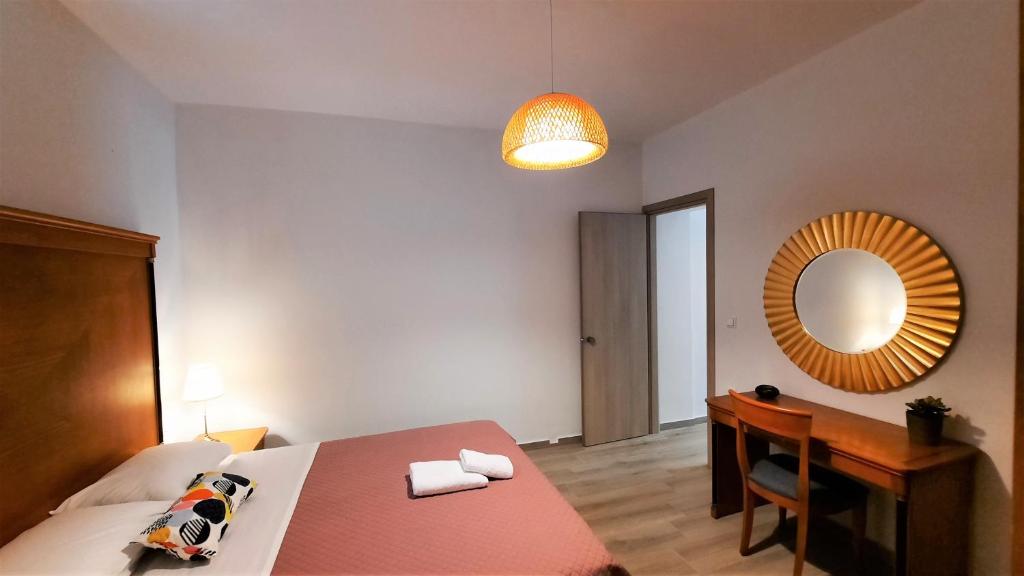Łóżko lub łóżka w pokoju w obiekcie Ismini Apartments Myrtos