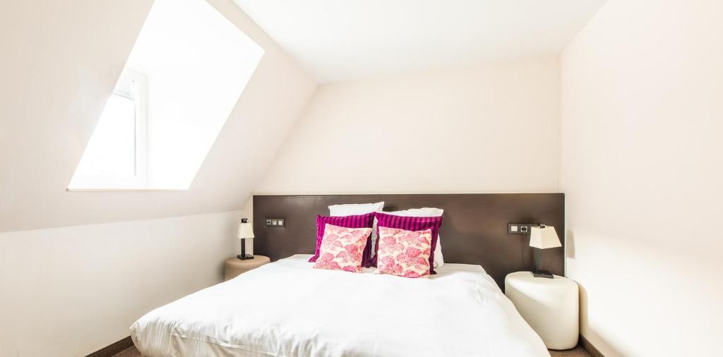 Postel nebo postele na pokoji v ubytování Hotel Malpertuus