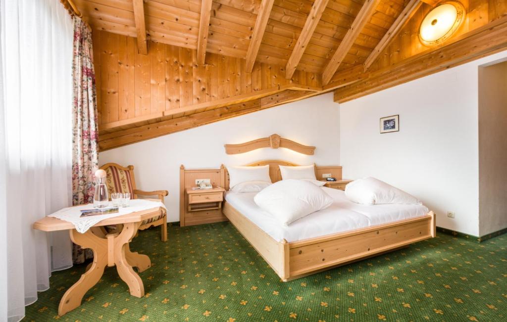 Postel nebo postele na pokoji v ubytování Hotel Moserhof