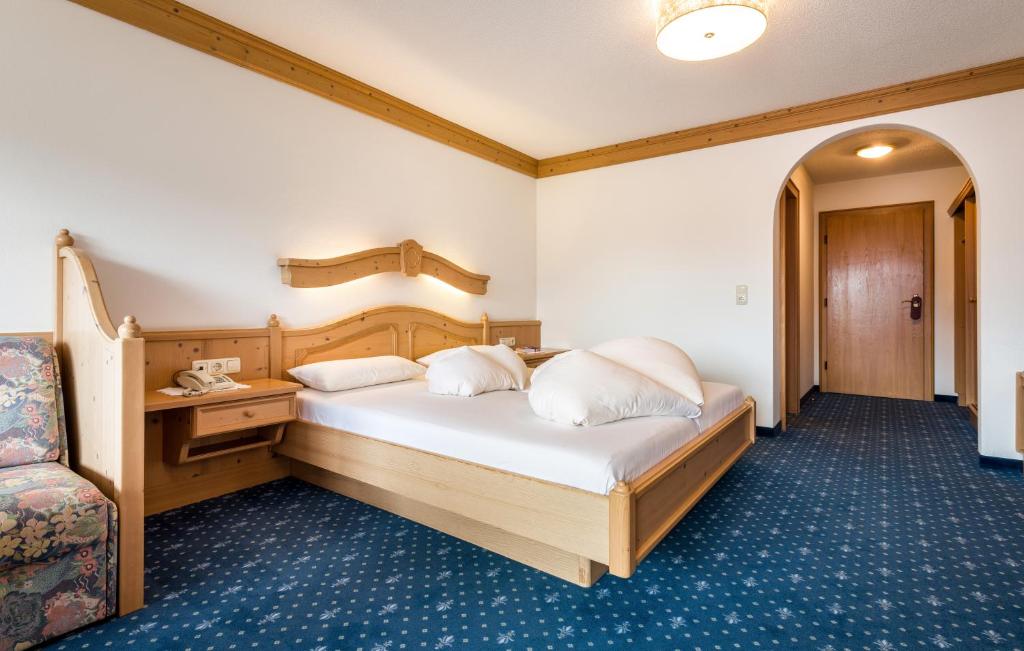 Postel nebo postele na pokoji v ubytování Hotel Moserhof