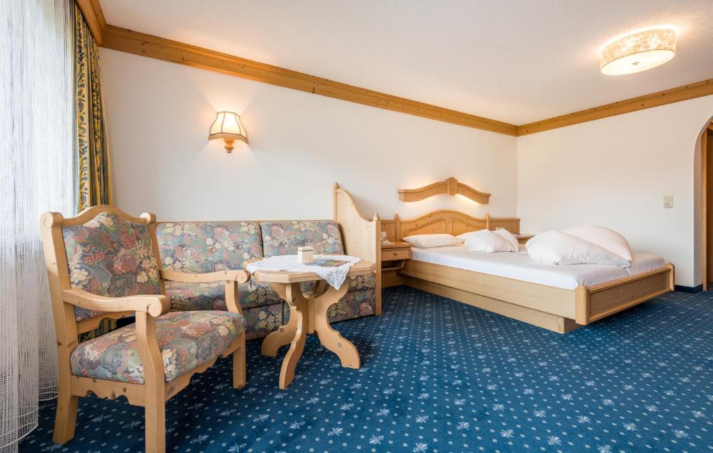 Postel nebo postele na pokoji v ubytování Hotel Moserhof
