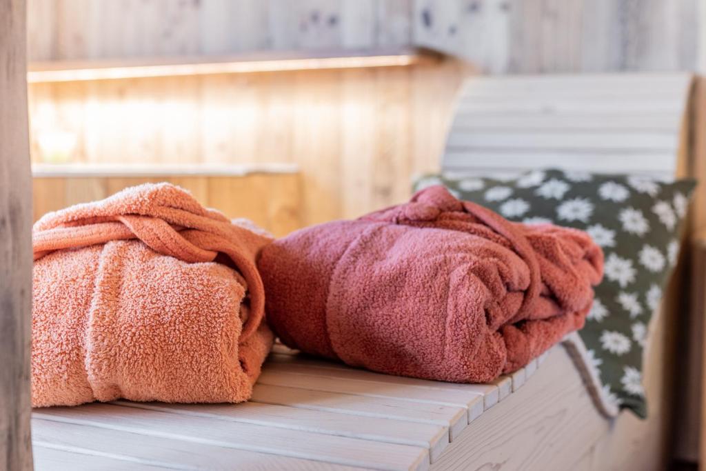Postel nebo postele na pokoji v ubytování Hotel Genzianella