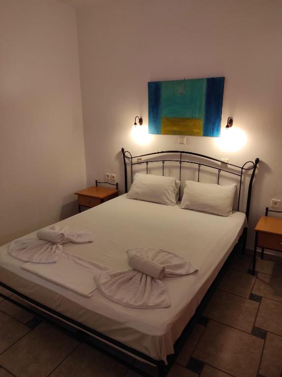 Postel nebo postele na pokoji v ubytování Chrouso Apartments