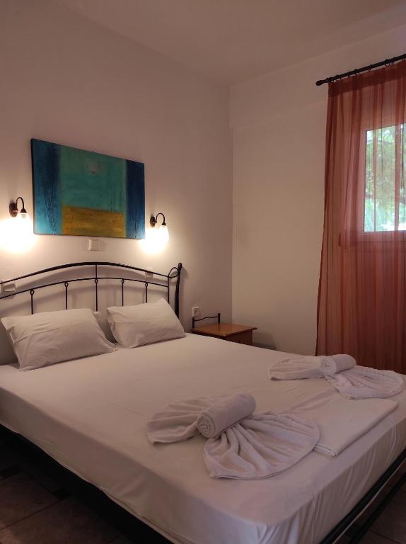 Postel nebo postele na pokoji v ubytování Chrouso Apartments