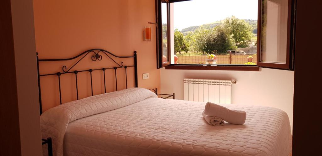 Postel nebo postele na pokoji v ubytování Apartamentos Fermín