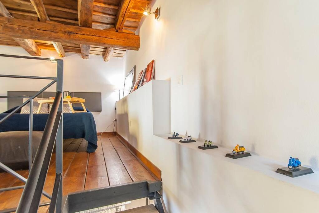 Posteľ alebo postele v izbe v ubytovaní L’Antico borgo di Trastevere