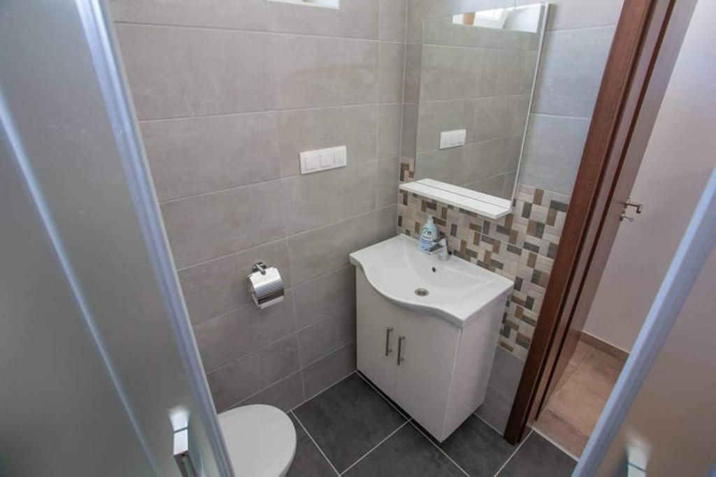 Kúpeľňa v ubytovaní Mona Apartman