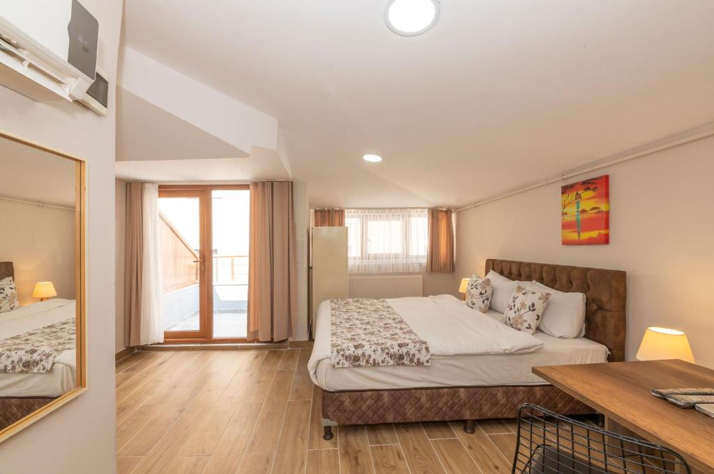 Postel nebo postele na pokoji v ubytování Marida Residence - Istanbul Taksim