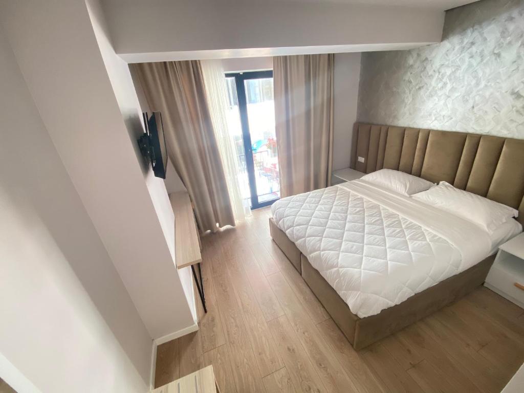 Postel nebo postele na pokoji v ubytování Hotel Alion