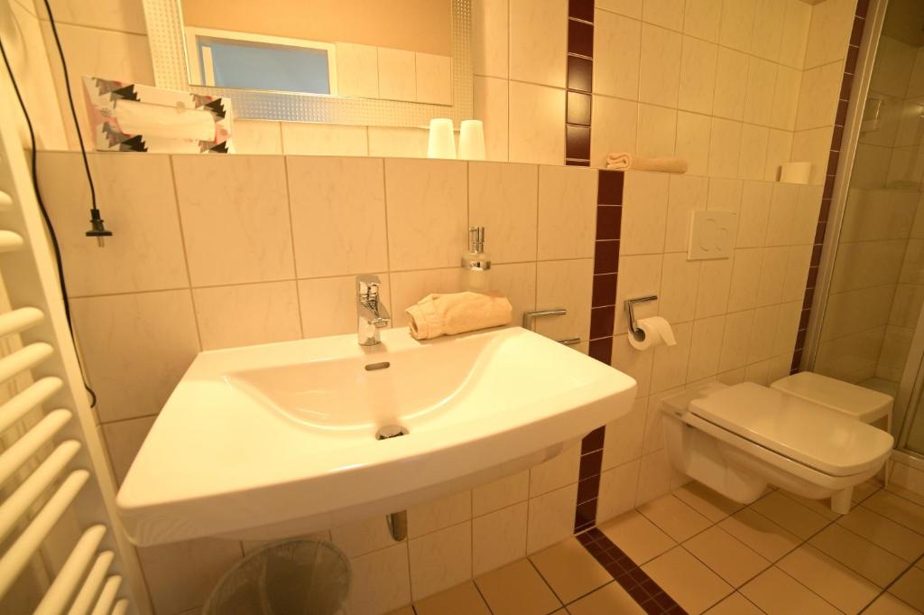 Koupelna v ubytování Hotel Zrenners GARNI